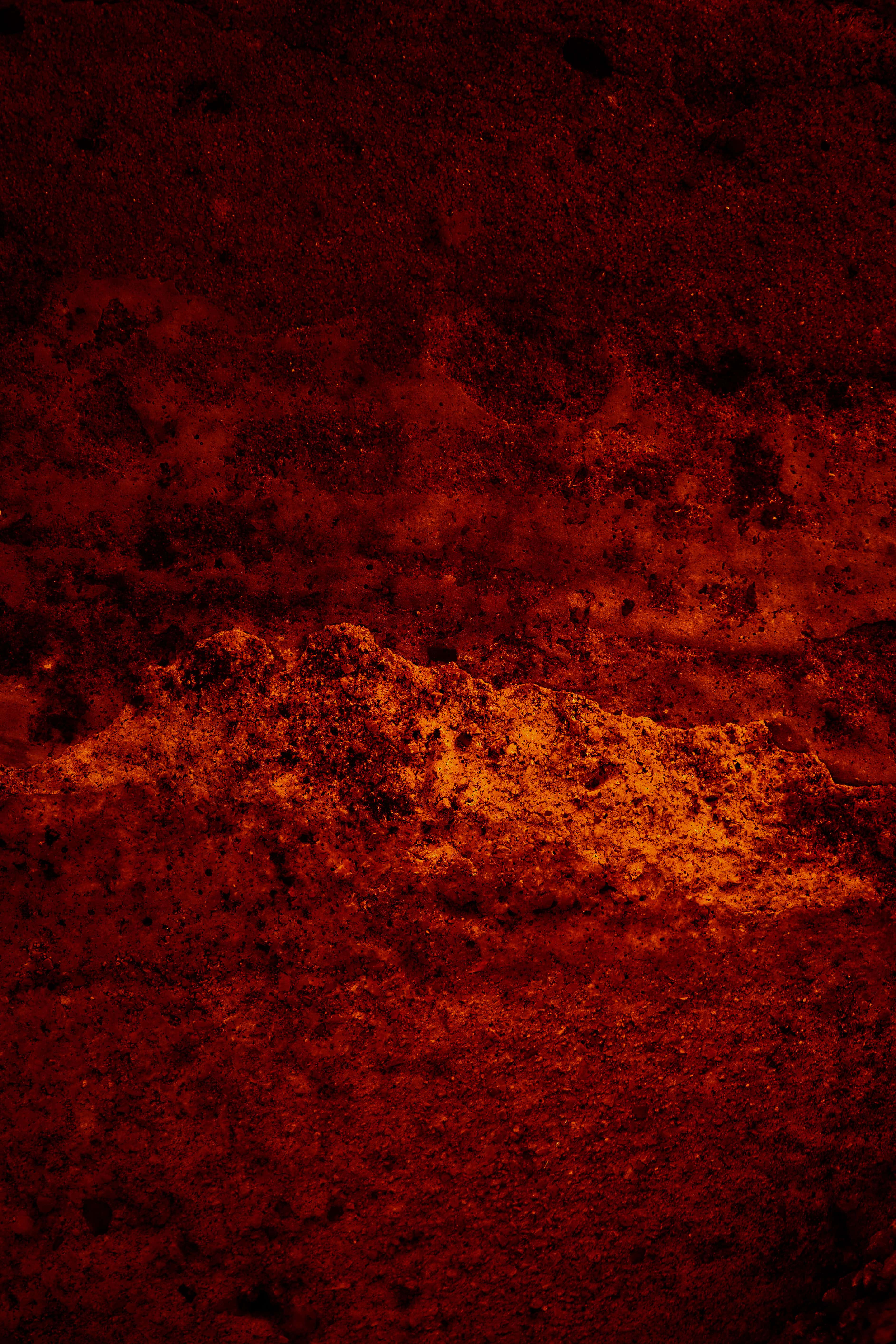 ruĝaa — Archaic textures and earthy tones evoke depth and time. The surface, a sedimented fragment, reveals ongoing transformation between dissolution and form.